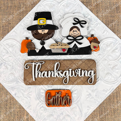 The Pilgrim Interchangeable Insert from Janet's Craft Corner is a DIY home decor kit that features a decorative design with a pilgrim couple, pumpkins, a pie, and an acorn. The word "Thanksgiving" is prominently displayed with "Gather" beneath it on a burlap-textured background, ideal for refreshing your Thanksgiving decor or creating unique craft projects.