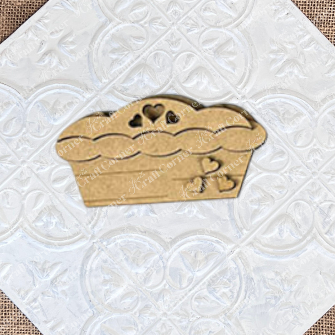 Enhance your tiered tray with the Give Thanks/Thanksgiving Tiered Tray Kit from Janet's Craft Corner, featuring charming wooden muffin-shaped pieces adorned with heart cutouts. It's a delightful addition to your home décor and sure to stand out.
