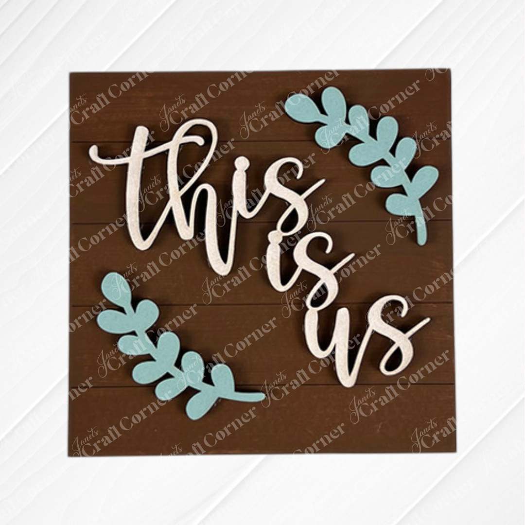 Family Home Squares by Janet's Craft Corner features "this is us" in white script with light blue leafy branches on a brown background—ideal for tiered tray decor or pairing with other wood cut-outs for a personalized display.