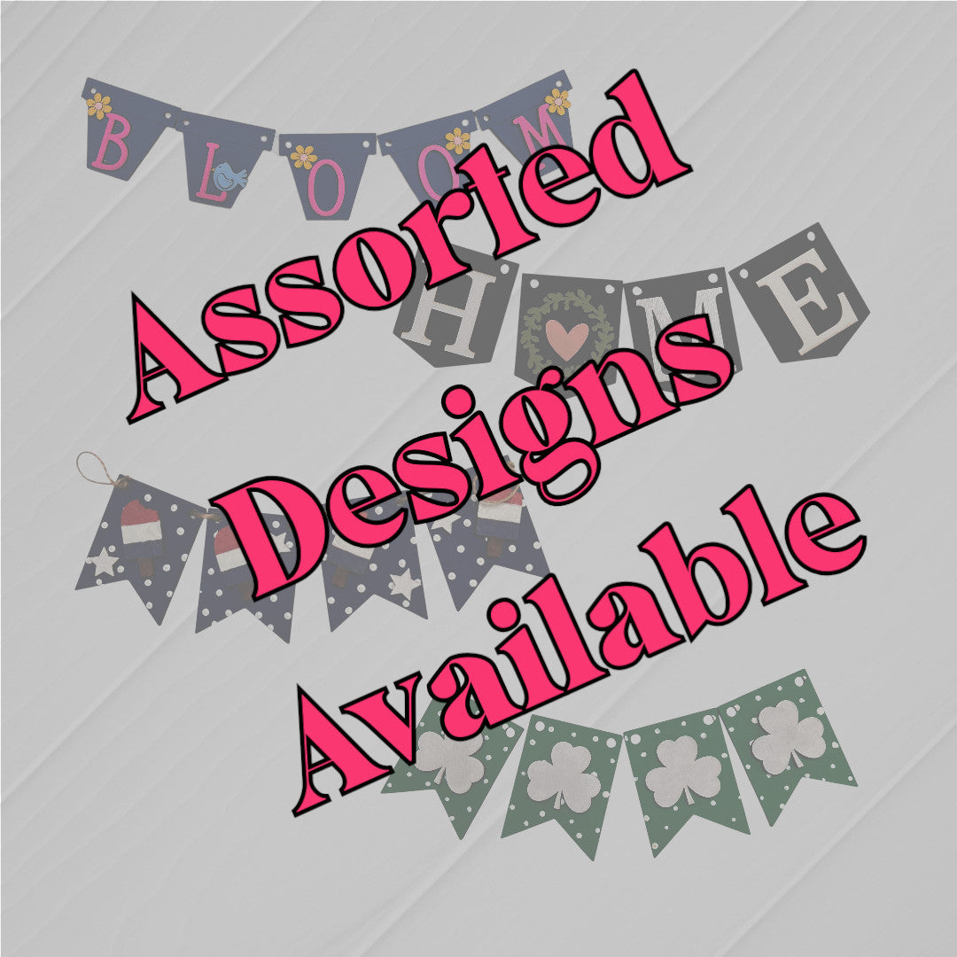 Janet's Craft Corner Tiered Tray Garlands in assorted designs like "BLOOM," "HOME," Santa hats, and shamrocks, shown on a light background. Bold pink text states: Assorted Designs Available.