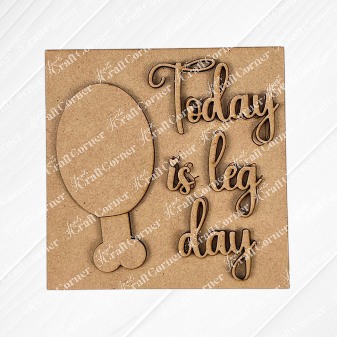 Janet's Craft Corner's "Thanksgiving Feast Squares" features a wooden board with a balloon wood cut-out and "Today is leg day" engraved in cursive—ideal for tiered tray decor.