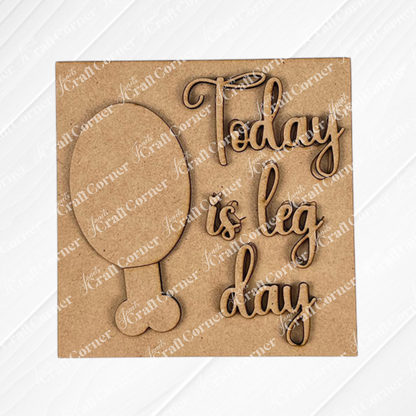 Janet's Craft Corner's "Thanksgiving Feast Squares" features a wooden board with a balloon wood cut-out and "Today is leg day" engraved in cursive—ideal for tiered tray decor.