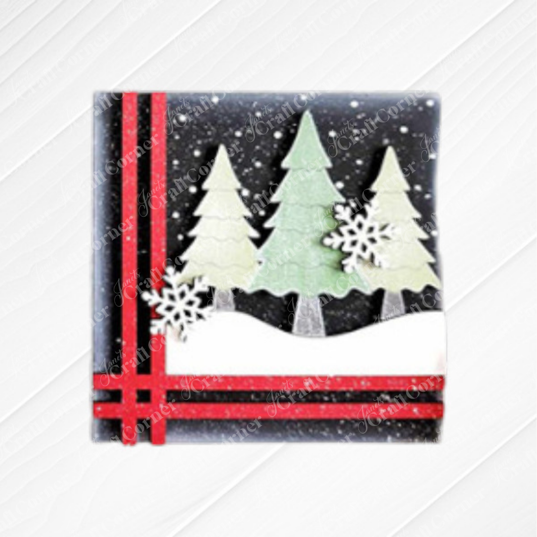 Janet's Craft Corner's Mistletoe Swappable Squares DIY kit lets you craft festive decor featuring Christmas trees in snowy scenery with snowflakes and red ribbon, inspired by wood cut-outs, perfect for the holiday season.