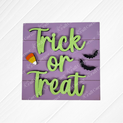 The Halloween Squares from Janet's Craft Corner is a purple wood sign with green "Trick or Treat" text, candy corn, and bats—ideal for tiered trays or Swappable Squares Halloween displays.