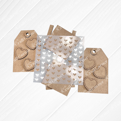 Janet's Craft Corner Valentine Gift Card Tags—DIY seasonal home decor craft kit (Set of 2)—feature scalloped heart cutouts and a plastic stencil, ideal for handmade keepsakes on a white textured background.