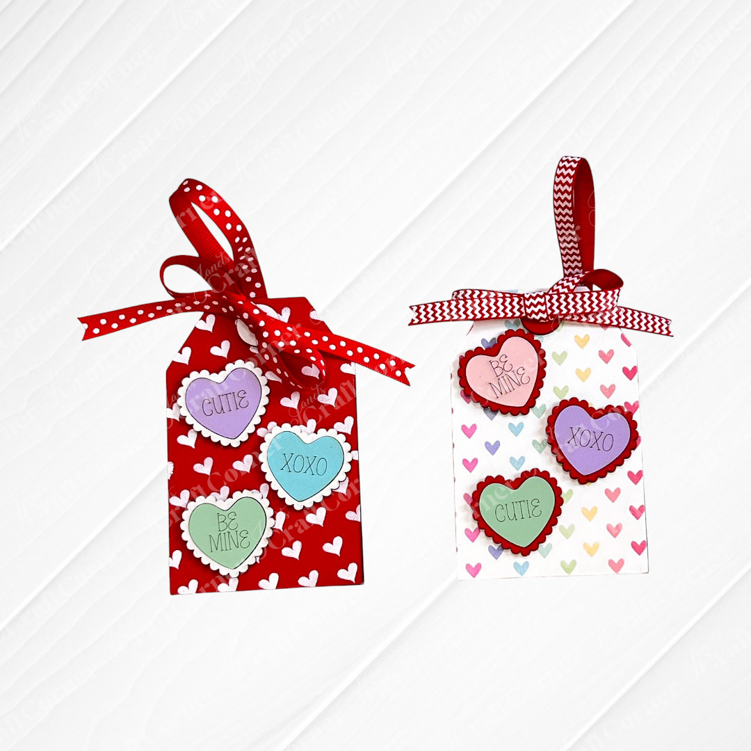 Janet’s Craft Corner Valentine Gift Card Tags—DIY seasonal home decor craft kit set of 2—features heart-shaped candies, red and white ribbons, and colorful messages on heart-patterned backgrounds; a perfect handmade keepsake for loved ones.