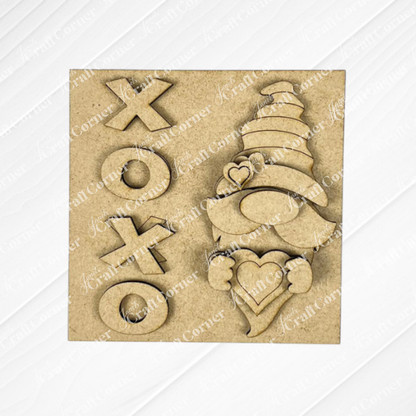 The Valentine Squares by Janet's Craft Corner is a square wooden plaque for tiered tray signs, featuring "XOXO" on the left and a gnome with a heart and tall hat with hearts on the right—perfect for festive DIY seasonal home decor kits.