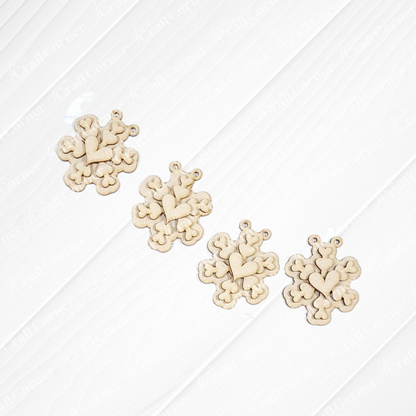 Four beige, heart-shaped snowflake ornaments from Janet's Craft Corner’s Valentine Snowmen Decor Set are arranged on a white background—each with a charming symmetrical heart design, ideal for your DIY seasonal home decor craft kit.