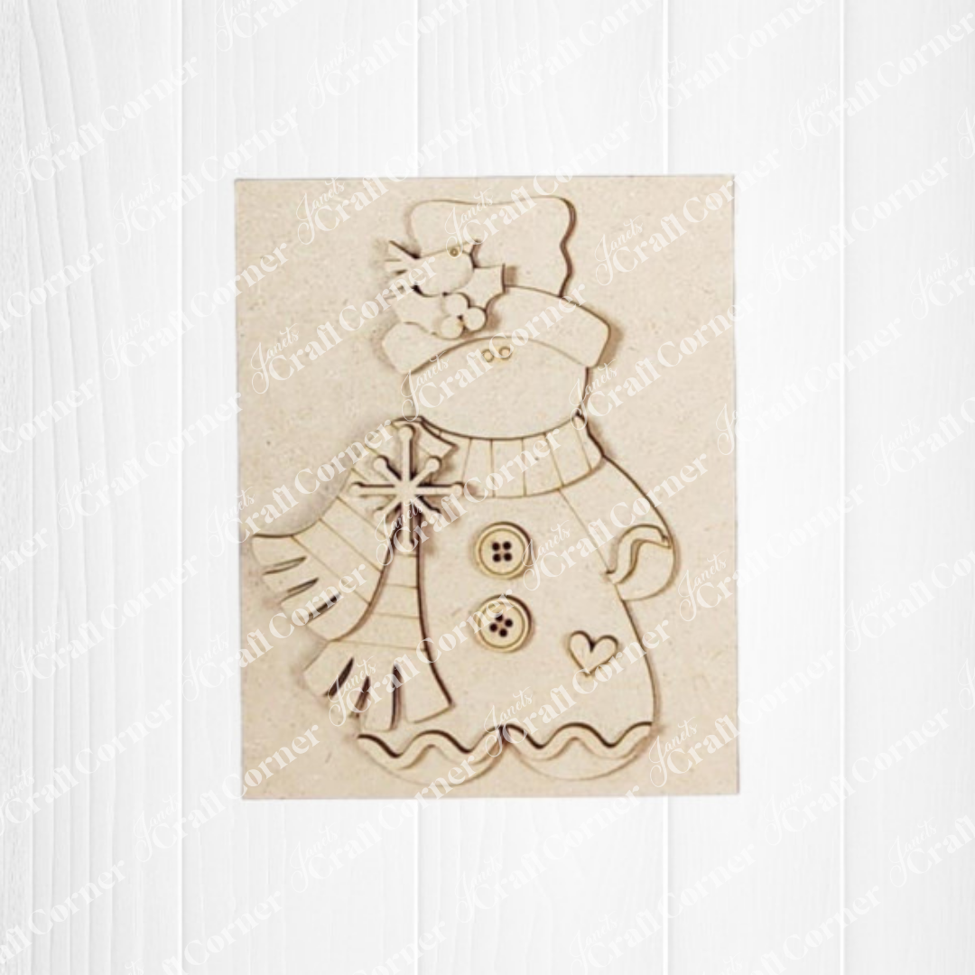 Decorative wooden cutout of a Victorian gingerbread man with a scarf on a white background