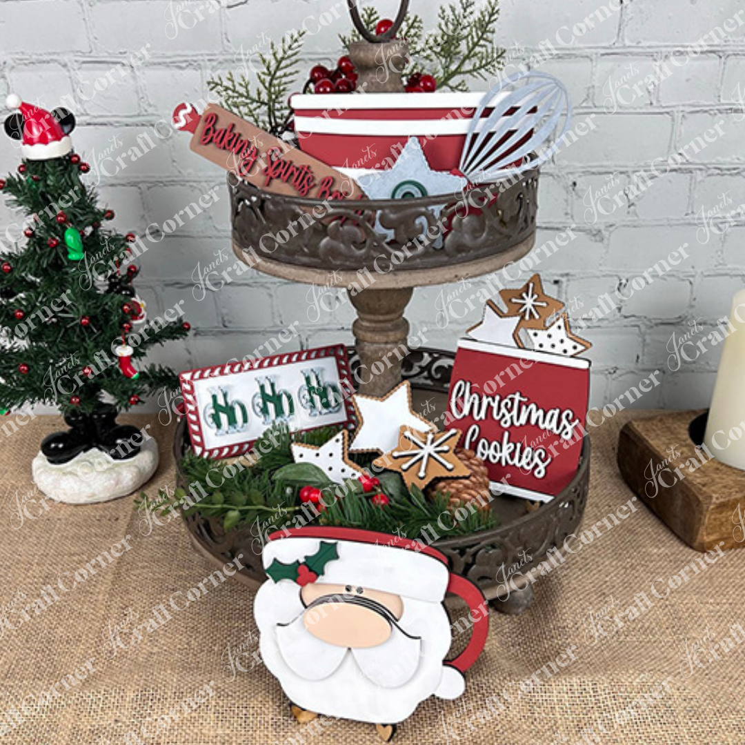 The Vintage Santa Cookies Decor Set by Janet's Craft Corner is a DIY craft kit with 6 festive pieces, including "Christmas Cookies" and "Baking Spirits Bright" signs, gingerbread cookies, a Santa cup, and greenery for charming holiday displays.