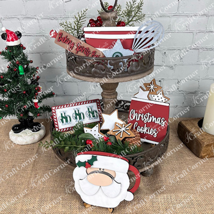 The Vintage Santa Cookies Decor Set by Janet's Craft Corner is a DIY craft kit with 6 festive pieces, including "Christmas Cookies" and "Baking Spirits Bright" signs, gingerbread cookies, a Santa cup, and greenery for charming holiday displays.
