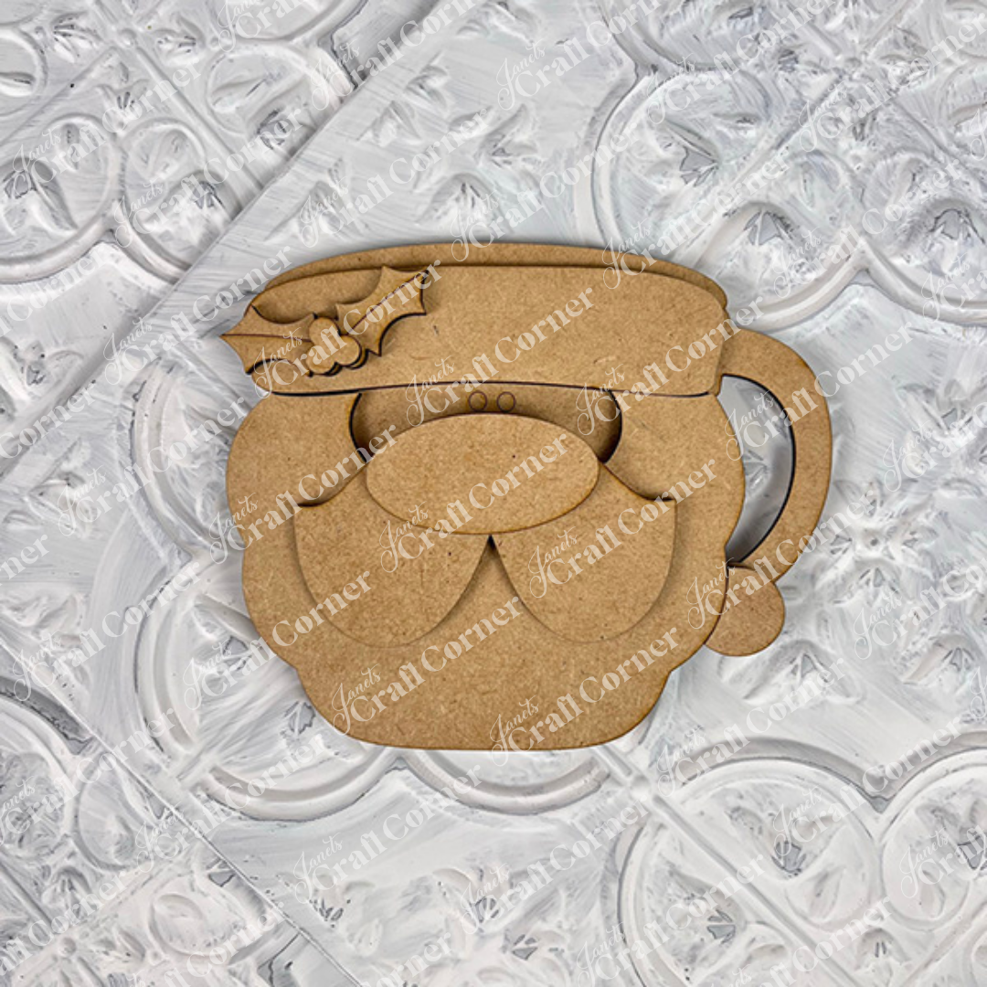 The Vintage Santa Cookies Decor Set from Janet's Craft Corner is a DIY craft kit featuring whimsical layered Santa faces, perfect for holiday home decor. Shown on a textured white background. Choice of 6 designs.