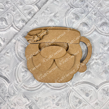 The Vintage Santa Cookies Decor Set from Janet's Craft Corner is a DIY craft kit featuring whimsical layered Santa faces, perfect for holiday home decor. Shown on a textured white background. Choice of 6 designs.