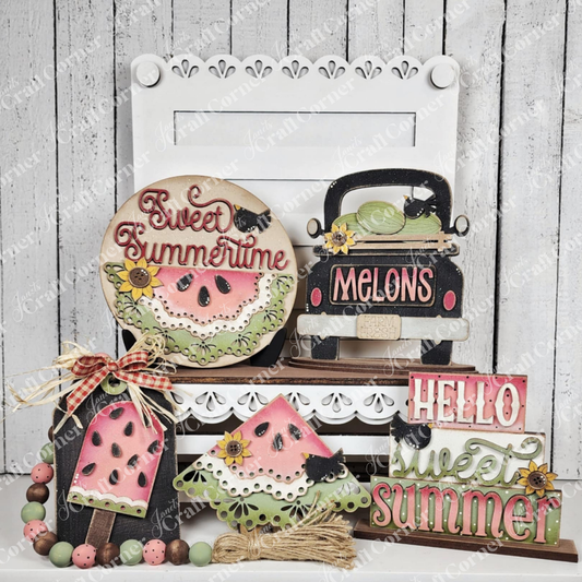 The Vintage Watermelon Decor Set by Janet's Craft Corner features summer-themed wooden cut-outs—watermelons, popsicles, a black truck with melons, and cheerful signs—perfect for charming DIY home decor displays.