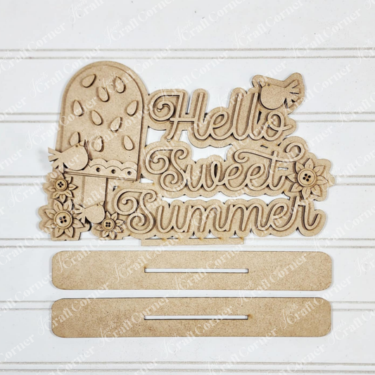 The Vintage Watermelon Word Art Shelf Sitter by Janet's Craft Corner is perfect for home decor or DIY crafting. This laser-cut sign features slotted pieces for easy assembly and looks stylish against a white wood paneling background.