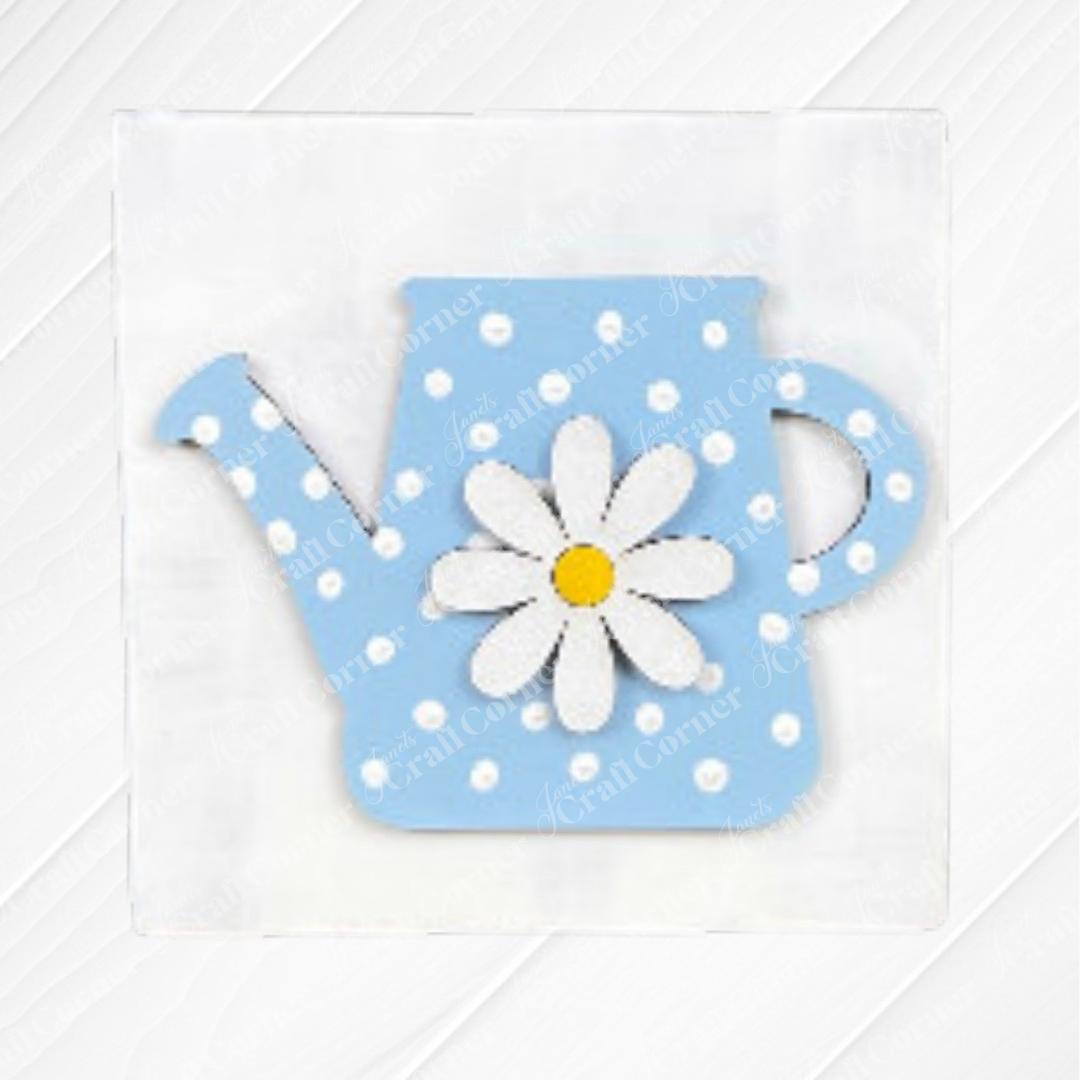 The Bloom & Grow Squares by Janet's Craft Corner features a blue watering can with white polka dots and a large white daisy, ideal for tiered tray decor, set against a light textured background.
