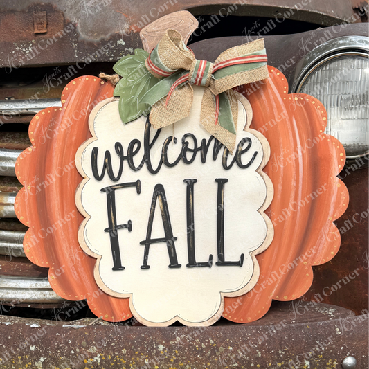 Add a touch of autumn charm to your home with Janet’s Craft Corner’s “Welcome Fall Pumpkin Wall Hanger” DIY home decor craft kit. This set of 1 features an unfinished, pumpkin-shaped wood cut-out sign, perfect for personalizing and displaying on doors, walls, or even a vintage vehicle grille. Accented with a burlap bow and ivy leaf motif, it’s a delightful way to celebrate the fall season in style!.