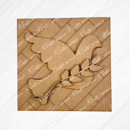 A square brown craft board from Janet's Craft Corner’s Religious Easter Squares features a wood cut-out bird with a branch, ideal for Swappable Squares or tiered trays. Displayed on white with "iCraft Corner" diagonal watermarks.