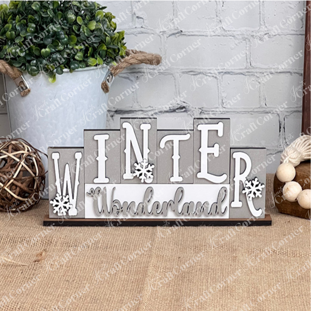 Decorative sign with 'Winter Wonderland' text on a rustic background