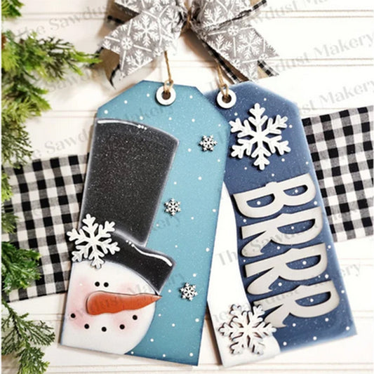 Janet's Craft Corner Winter Door Tags: Set of 2 wooden tags—one with a snowman in a black hat, one with "BRRR" and snowflakes. Each includes a gray patterned ribbon; perfect for DIY decor or your seasonal craft kit.