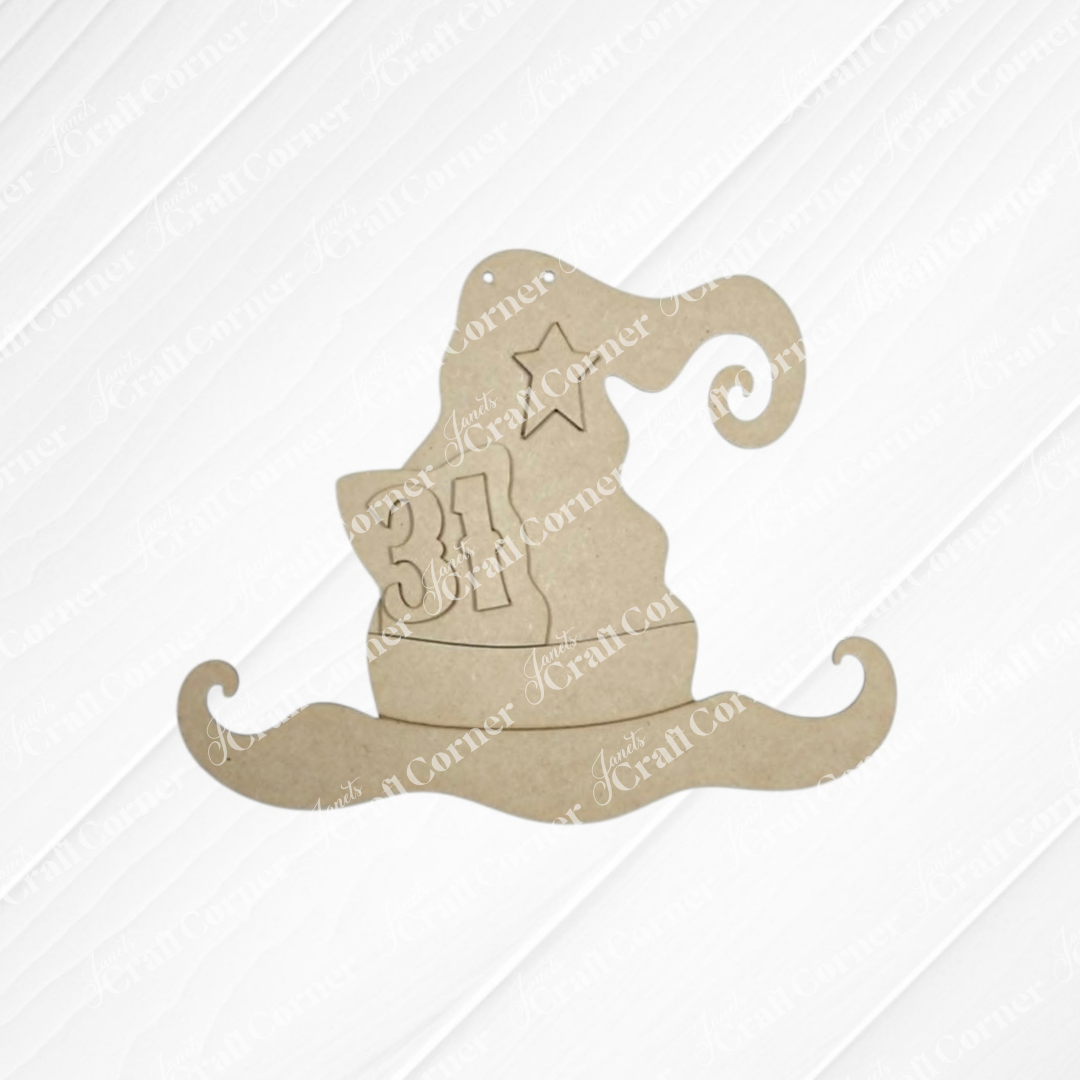 The Witch Hat Wall Hanger by Janet’s Craft Corner features a whimsical wooden cutout shaped like a wizard hat, engraved with a star and the number “31.” Set against a light textured background, this piece is perfect as a DIY wood craft kit for creating unique Halloween decor or as a festive witch hat wall hanger for your home.