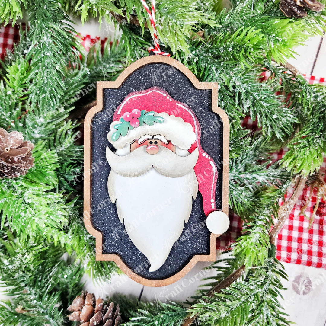 Add festive cheer to your holiday crafts with Janet's Craft Corner’s North Pole Ornaments DIY kit—includes one ornament featuring a painted Santa face, red hat, and white beard, perfect for seasonal home décor.