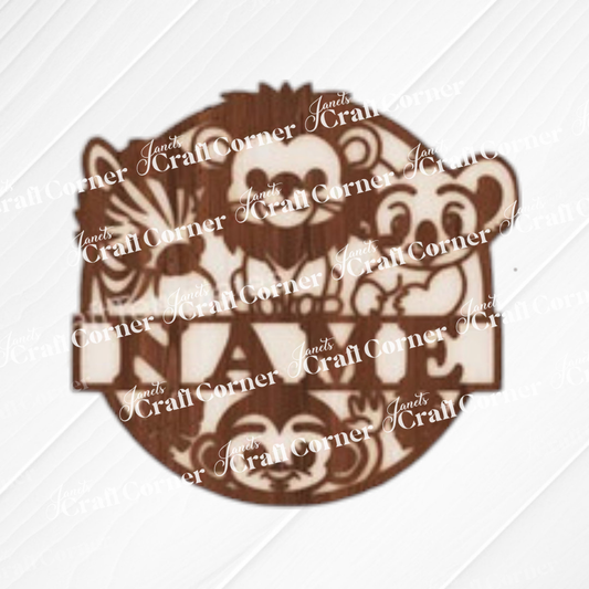 The Nursery Name Wall Hanger by Janet's Craft Corner features cartoon zebra, lion, monkey, and koala faces with a blank space for a name. This unfinished wood sign is ideal as a DIY home decor kit.