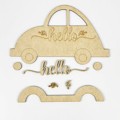 On a white background, you'll find wooden craft pieces shaped like a Volkswagen, the word "hello," and decorative leaves. This DIY kit, named Hello Volkswagen by Janet's Craft Corner, features a car shape divided into parts for easy assembly, making it an ideal choice for charming farmhouse decor or as a shelf sitter.